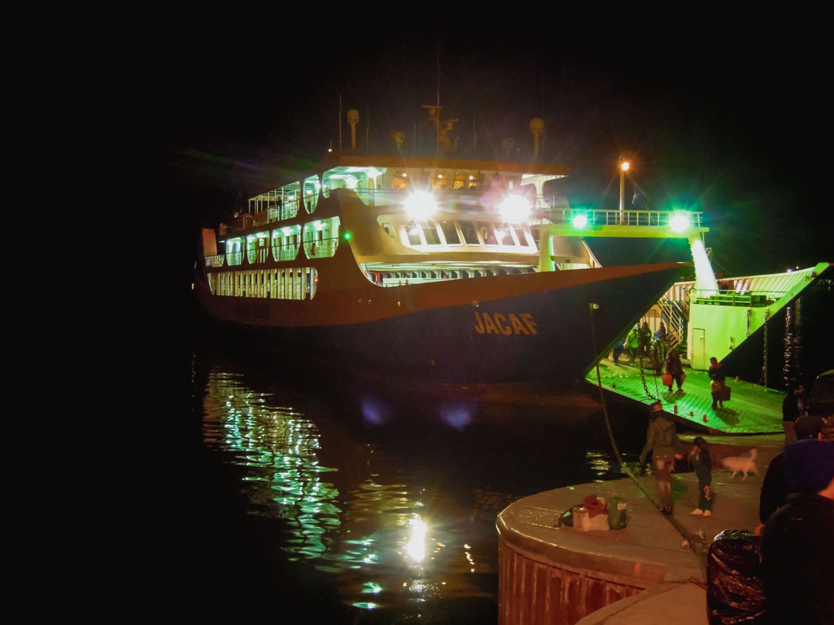 Ferry boat at night preparing to load passengers on Chiloe island in Chile.