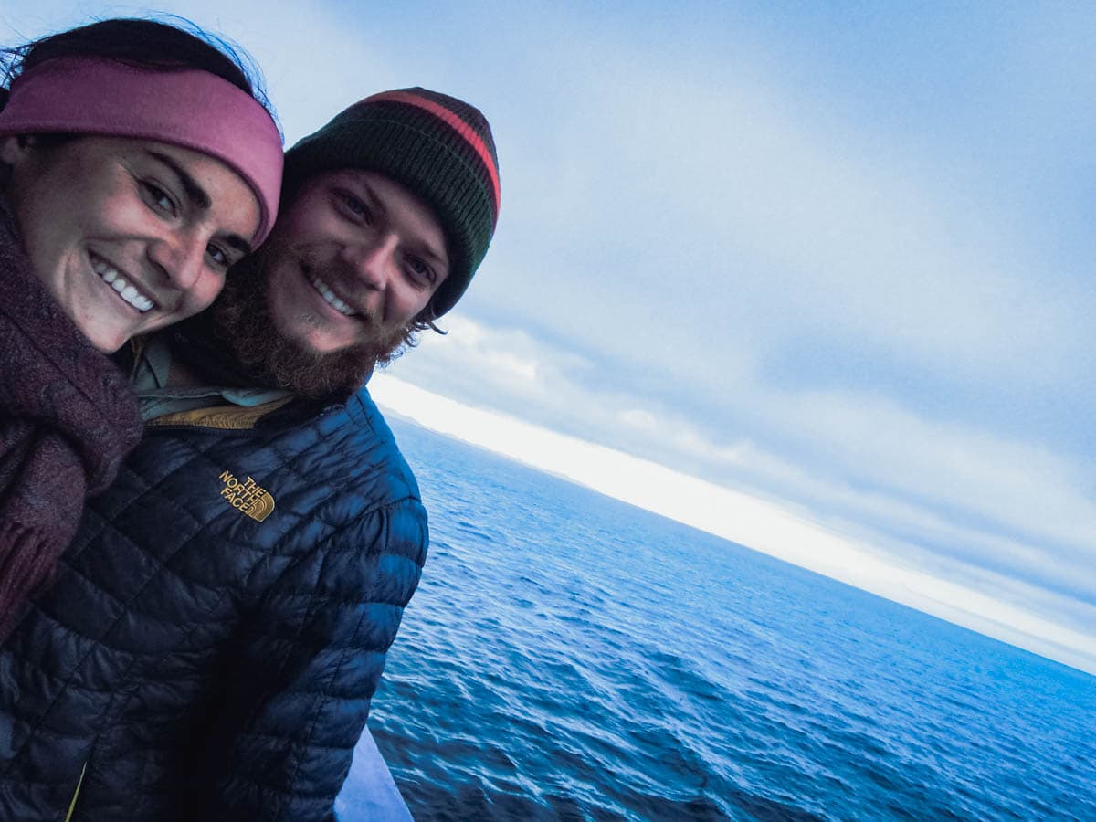 young couple enjoy ferry boat ride.