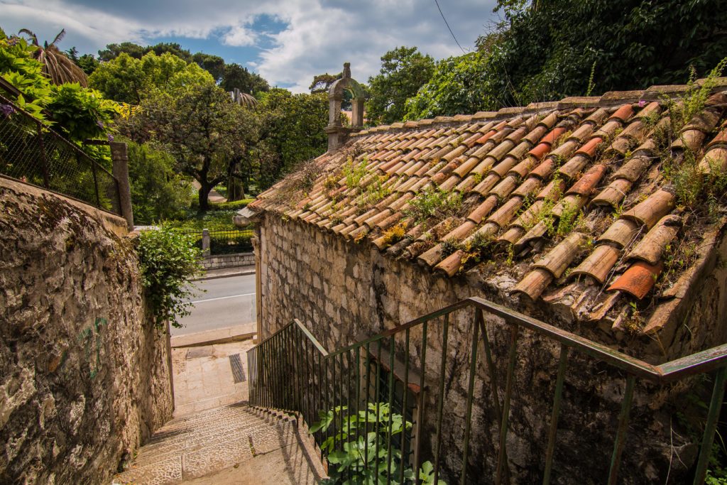 old church brick building with tiled roof built into the hillside