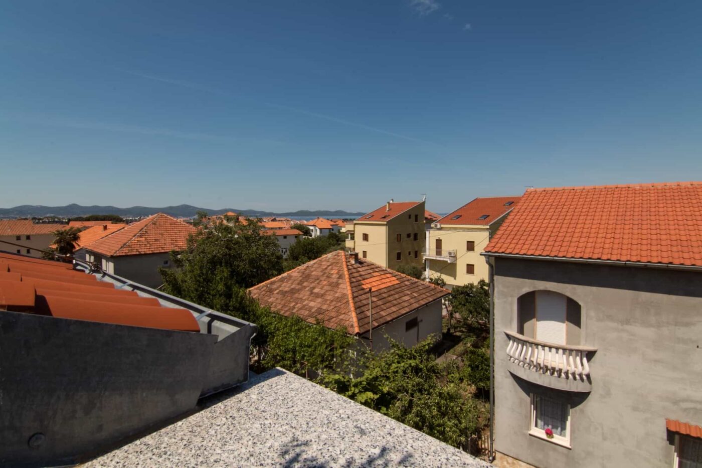 View from top of hotel of the village and other building tops.