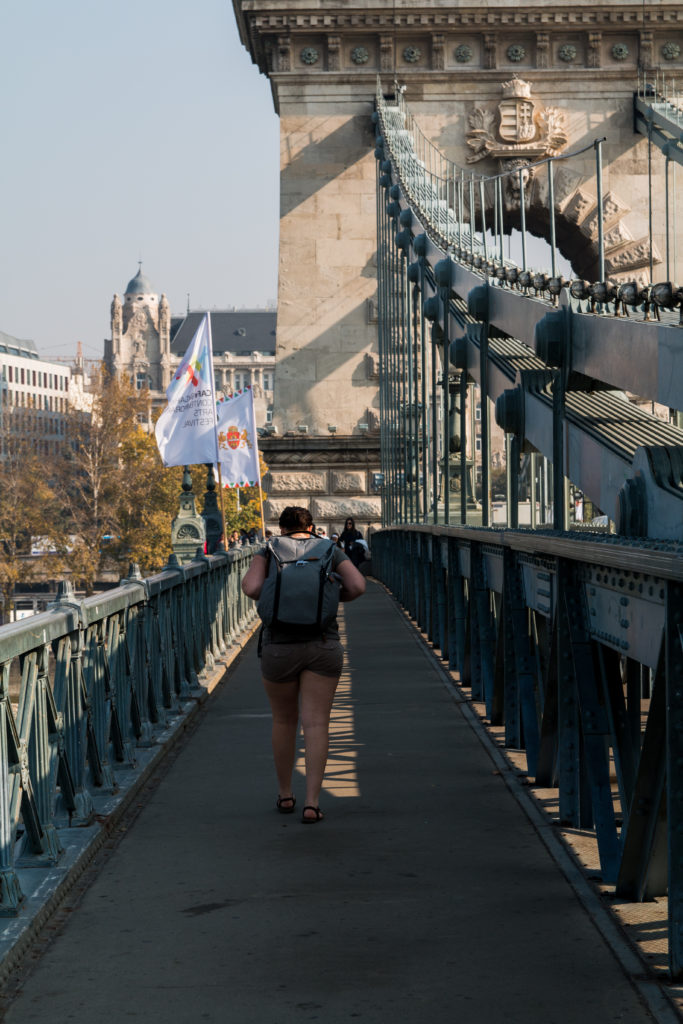 Girl walking across chain bridge, peak design everyday backpack, Chain Bridge, Budapest, Hungary, Arboursabroad
