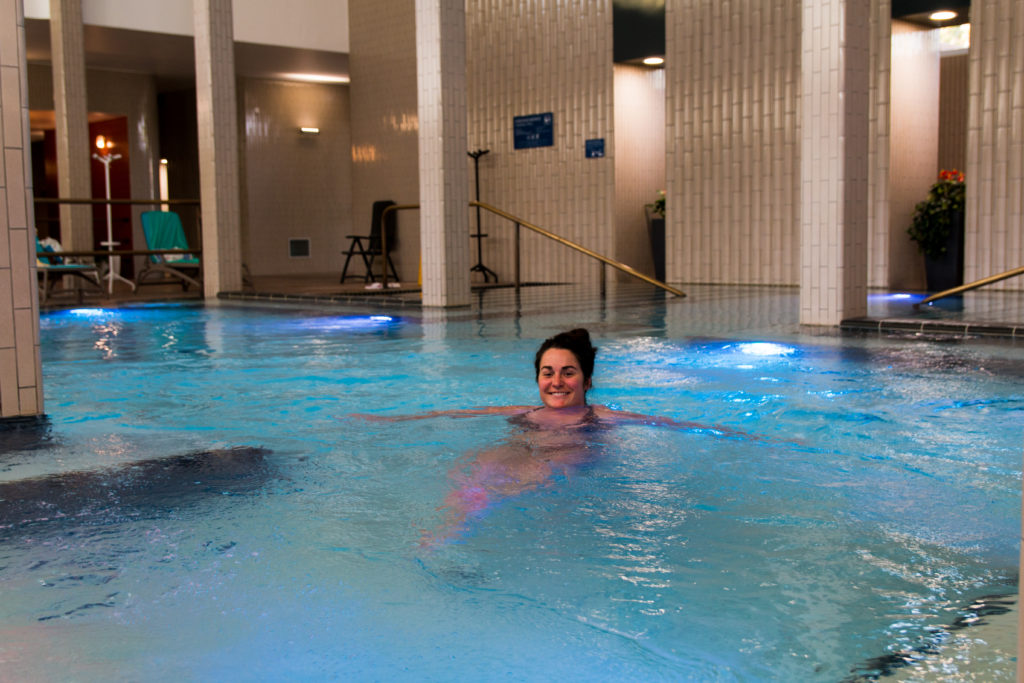 woman relaxing in blue water, thermal pools in Budapest, Palatinus Baths, arboursabroad
