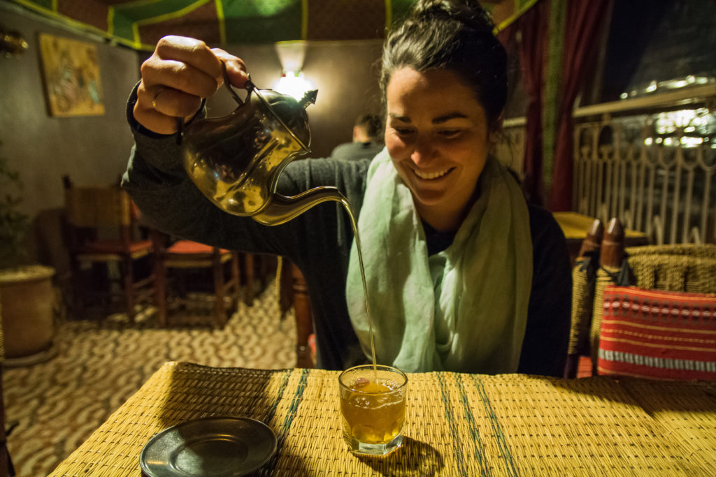 mint tea, woman pouring tea, tea pot, moroccan tea, arboursabroad