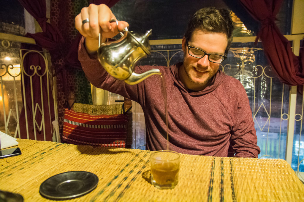 man pouring tea, Moroccan Tea, mint tea, tea pot, arboursabroad