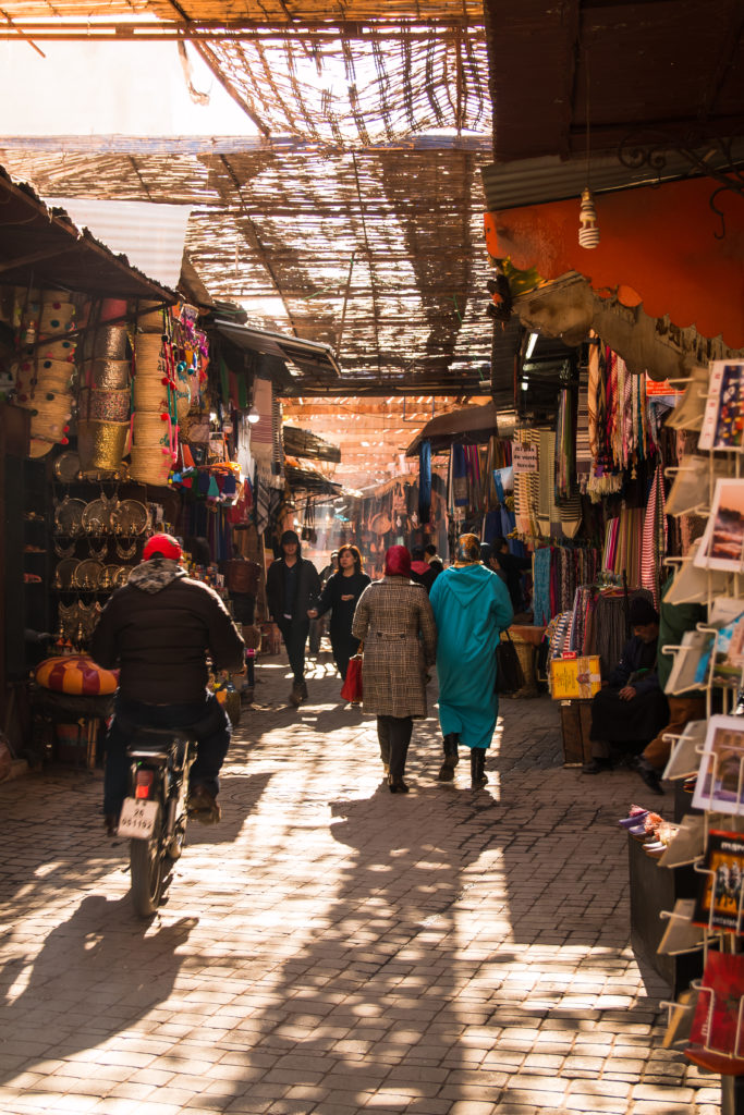 women and motor bike in Souks of Marrakech, Marrakech, culture, arboursabroad, Morocco