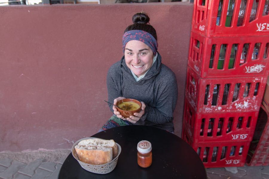 woman warming up with Berber Soup, lunch stop, Marrakech to Sahara, arboursabroad