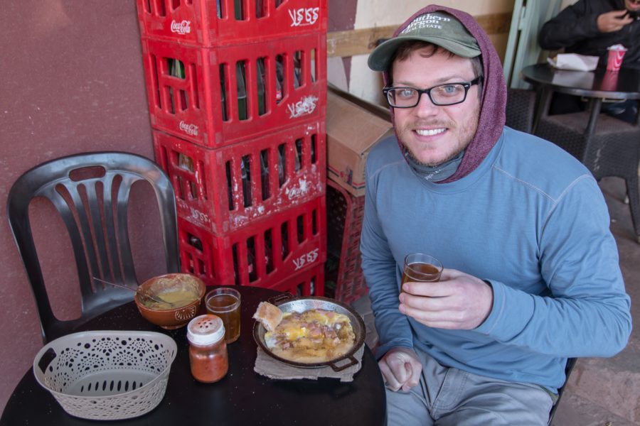 man with tea and berber omelette, Morocco food, arboursabroad