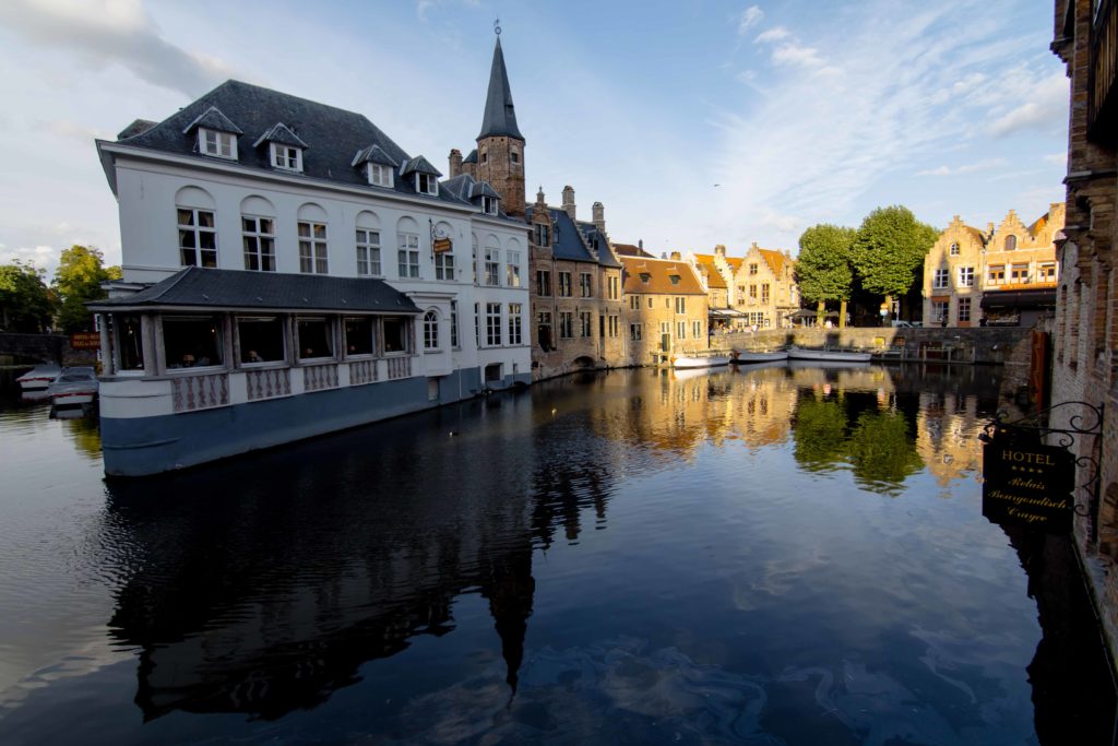 white house on canal, things to do in Bruges, Belgium, canal, arboursabroad