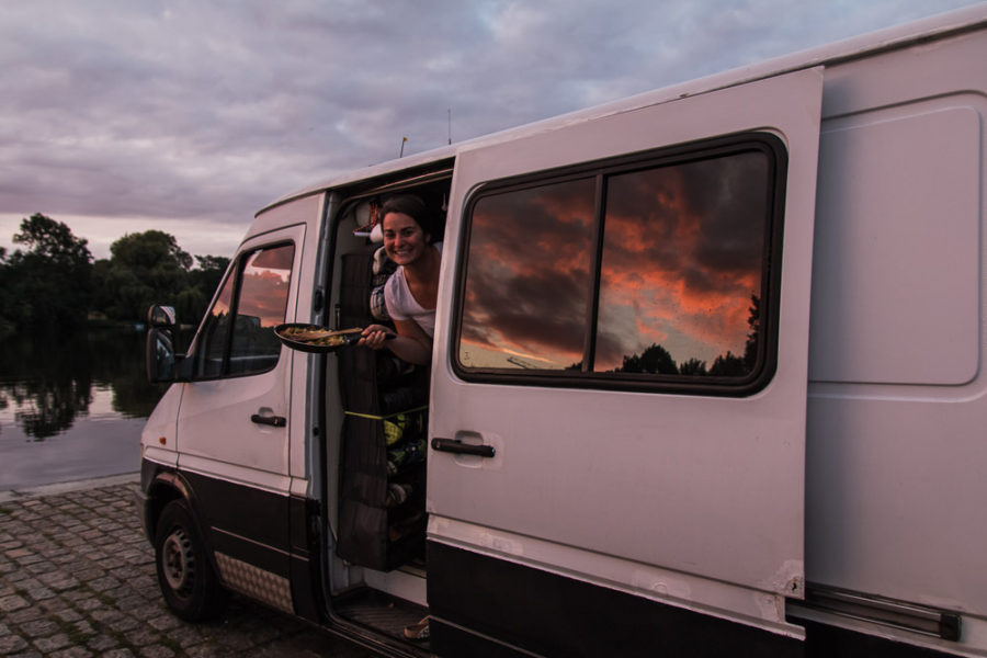 sunset reflecting in van windows, pink and purple sunset, vanlife dinner, arboursabroad