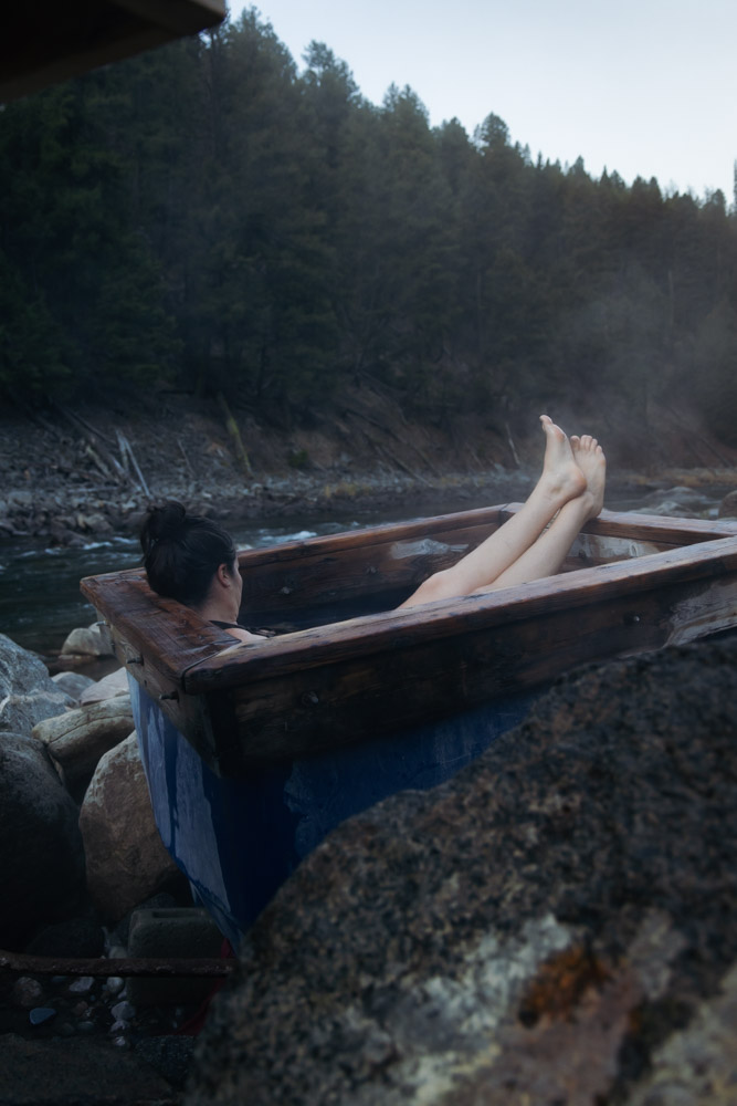 woman soaking in a hot spring bath, arboursabroad, Sunbeam Hot Spring, Stanley, Idaho