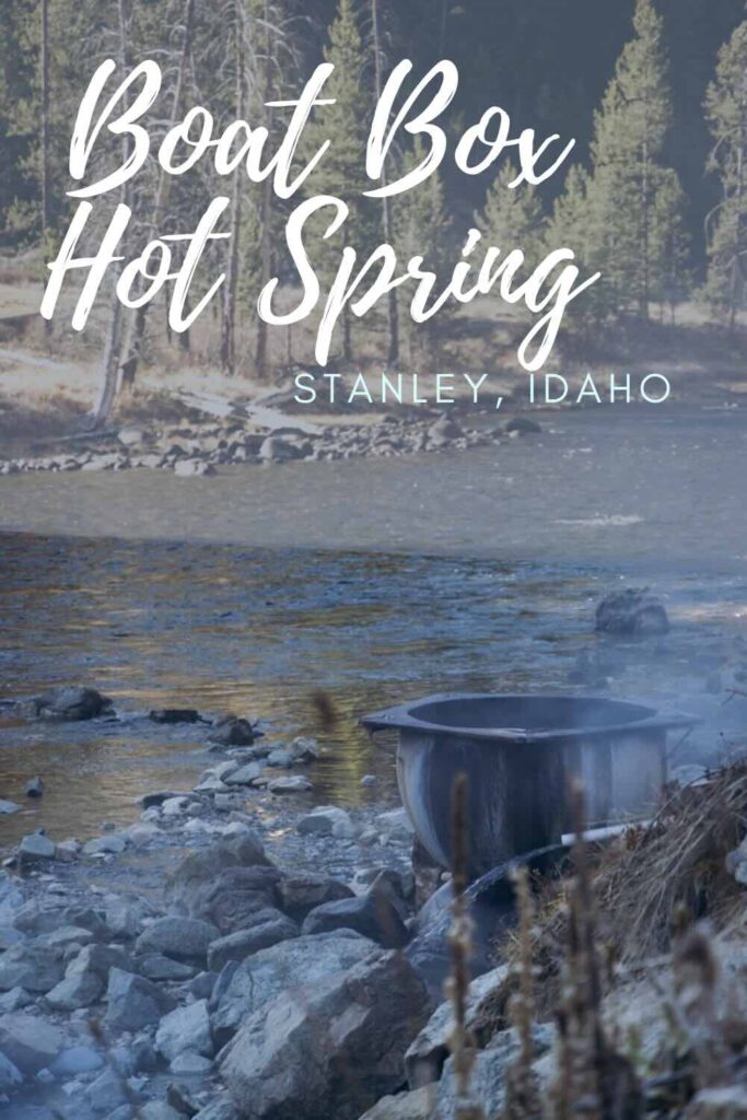 Hot spring with metal caldron near river.