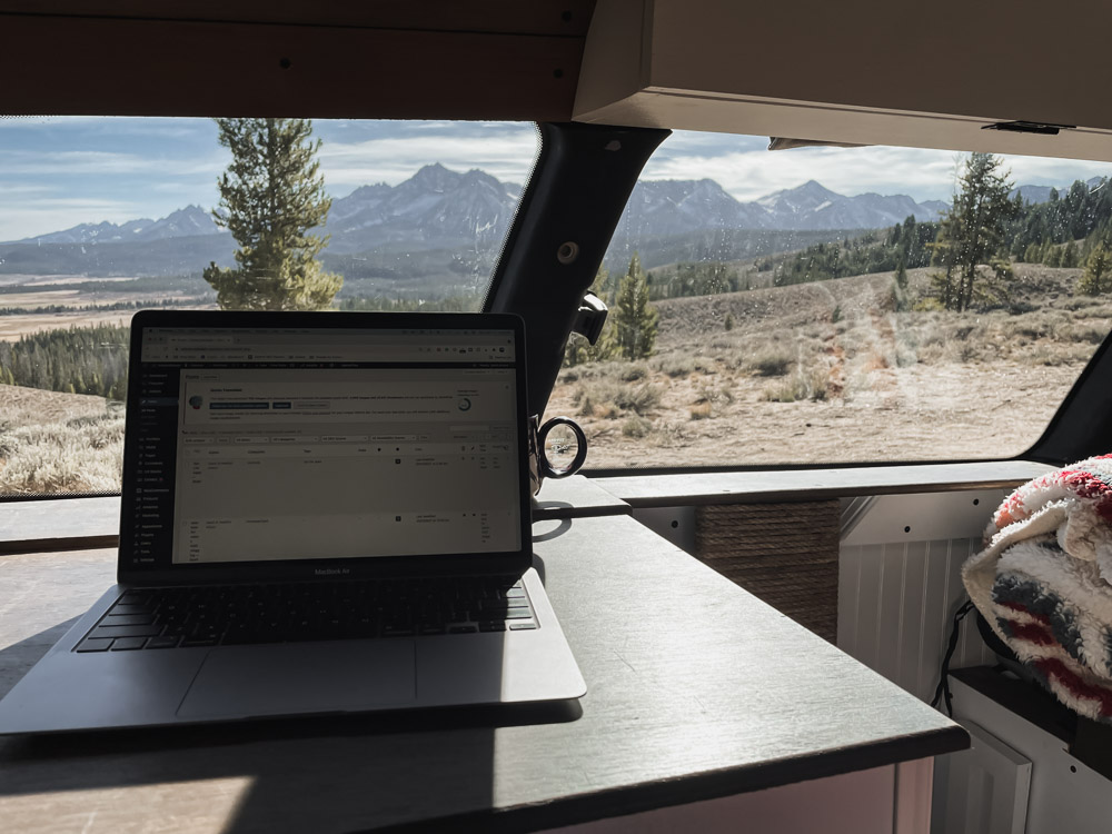 van conversion, computer on table with view, arboursabroad