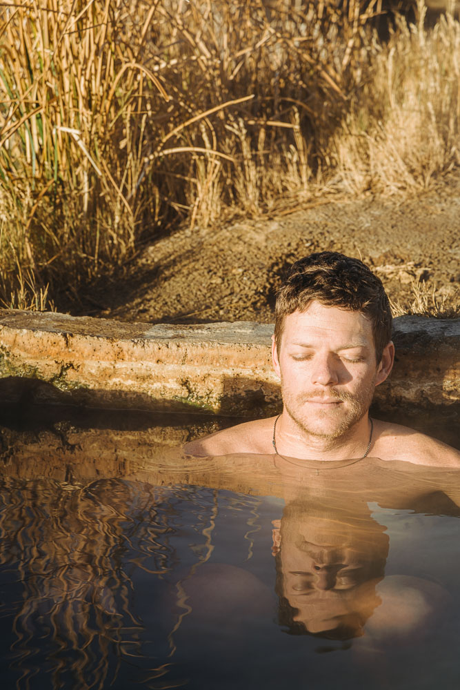 man soaking in hot spring, Baker Hot Spring, ArboursAbroad