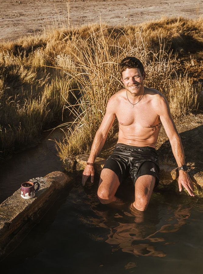 man soaking in hot spring, ArboursAbroad, van life
