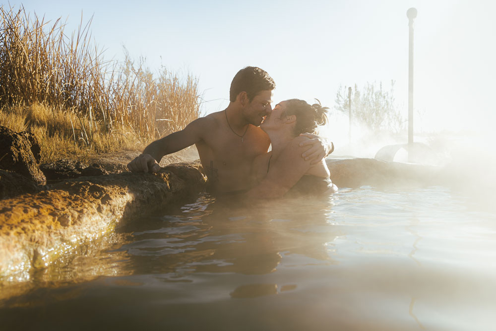 couple in hot spring at sunrise, ArboursAbroad