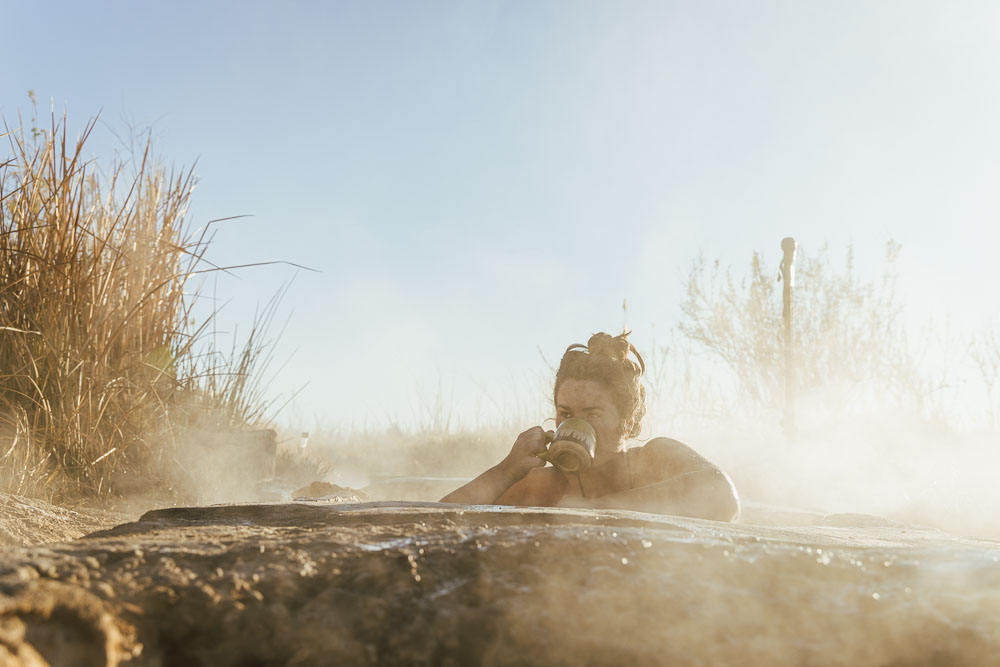 woman drinking coffee in Baker Hot Spring, Utah, ArboursAbroad