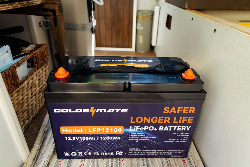Goldenmate 12v 100ah LiFePO4 Battery sitting in campervan minivan before getting installed.