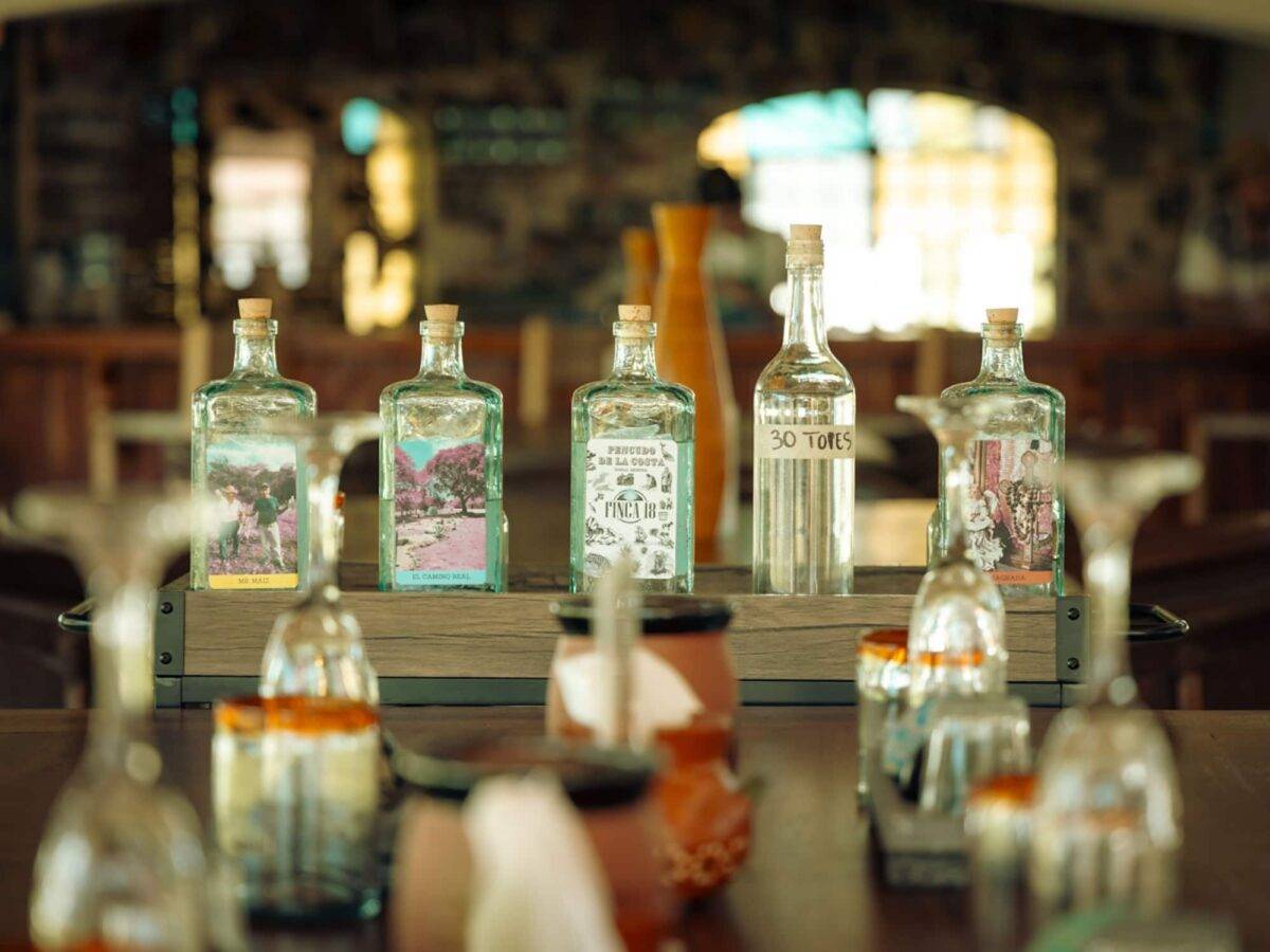 A tequila tasting in Puerto Vallarta set up at Finca 18 with five different tequilas to try.
