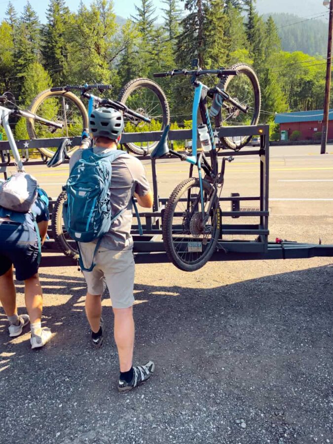 Jay putting the mountain bikes on a bike shuttle trailer in Rhododendron, Oregon.