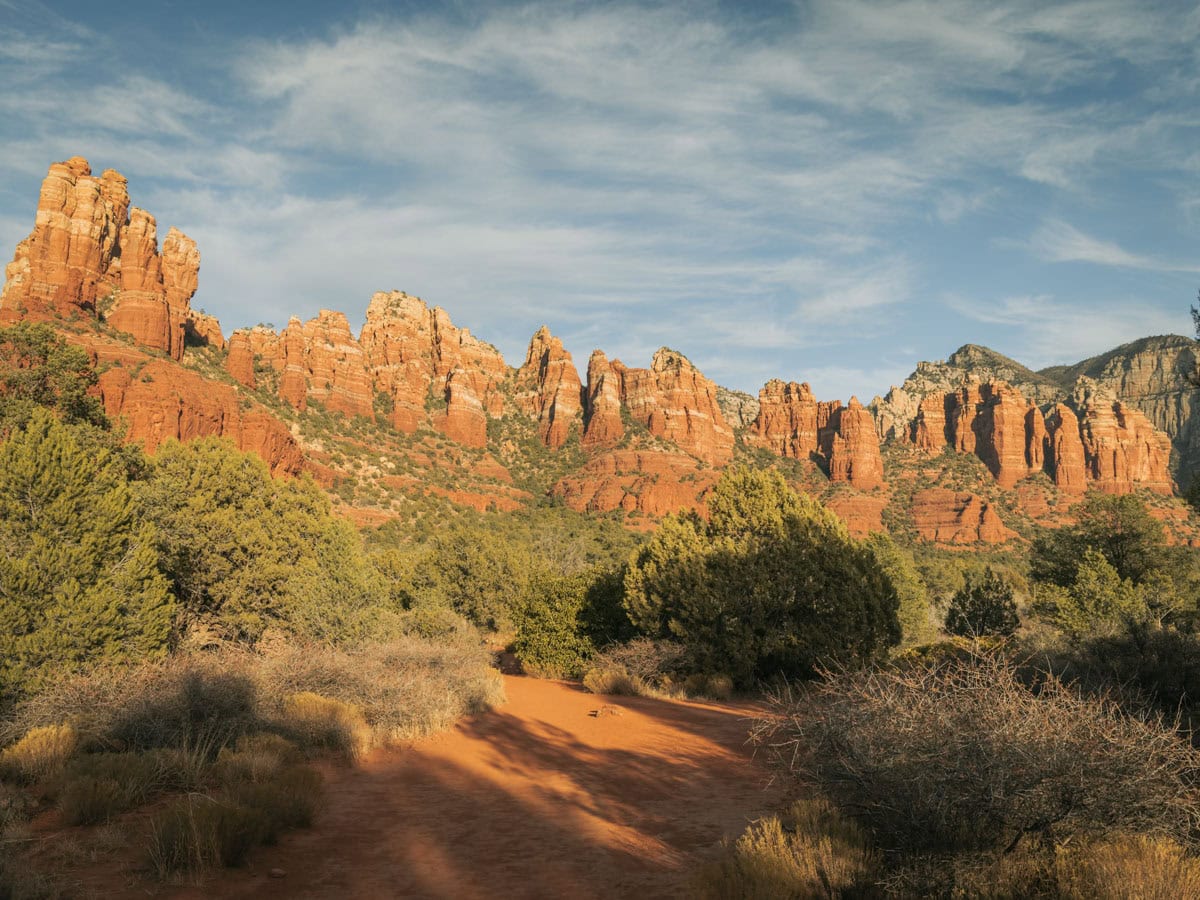 Munds Mountain Wilderness in Sedona with famous red rock cliffs glowing in the sunset lighting.