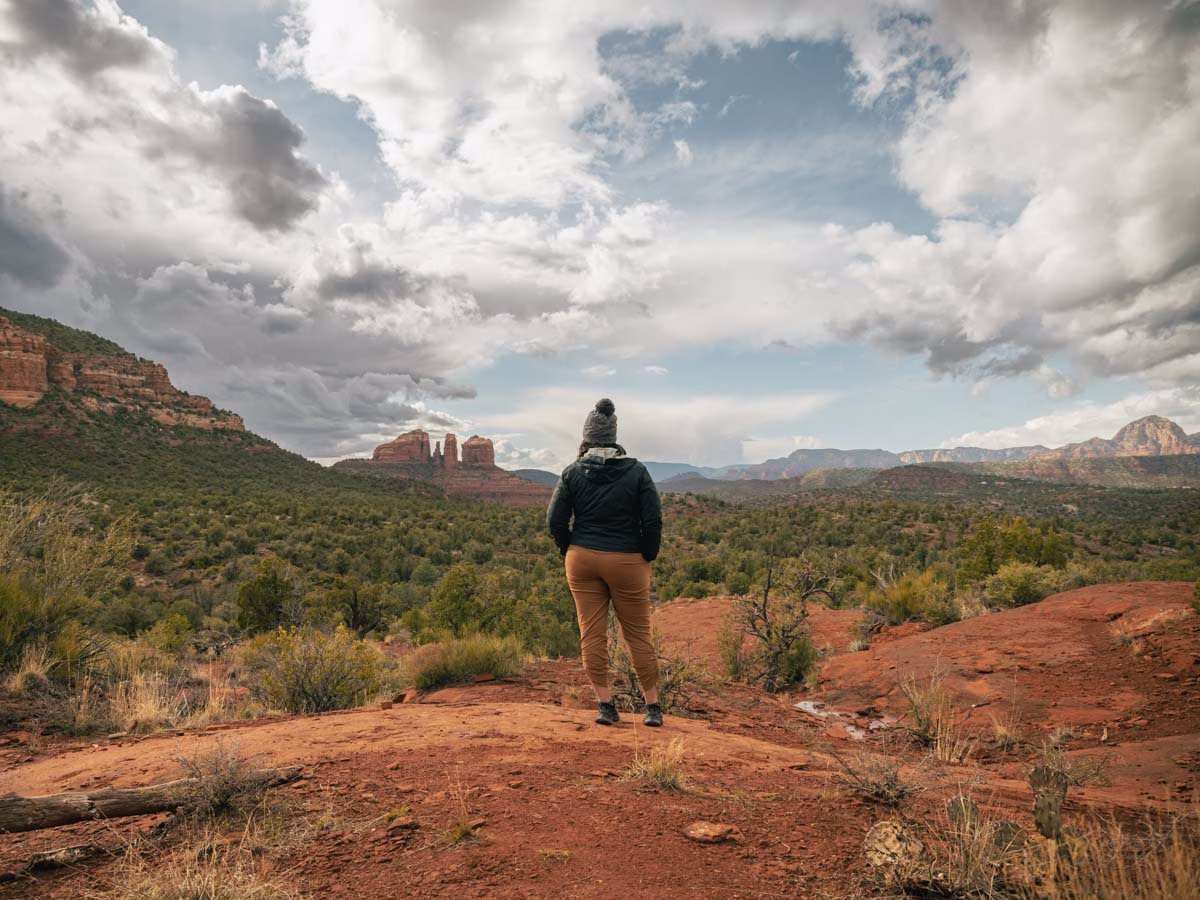 Heather looking out at Cathedral Rock from Baby Bell Rock in Sedona, Arizona.