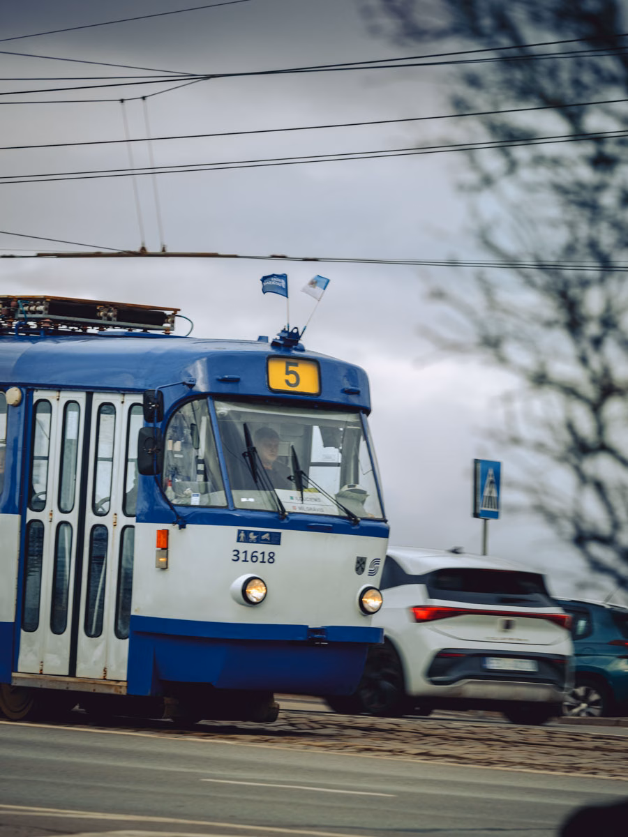 Blue and white public tram on the streets of Riga, Latvia