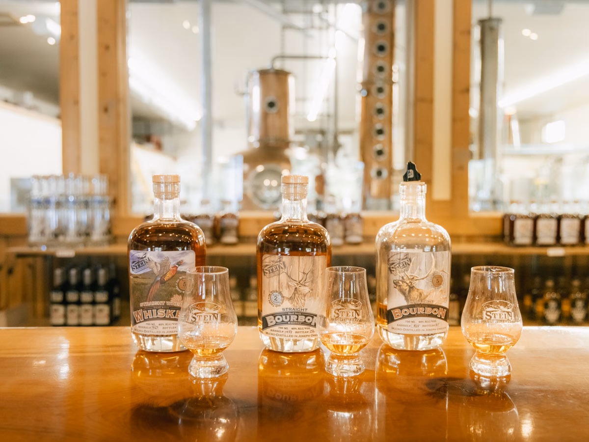 Bottles and tasting glasses on the bar at Stein Distillery in Joseph, Oregon.