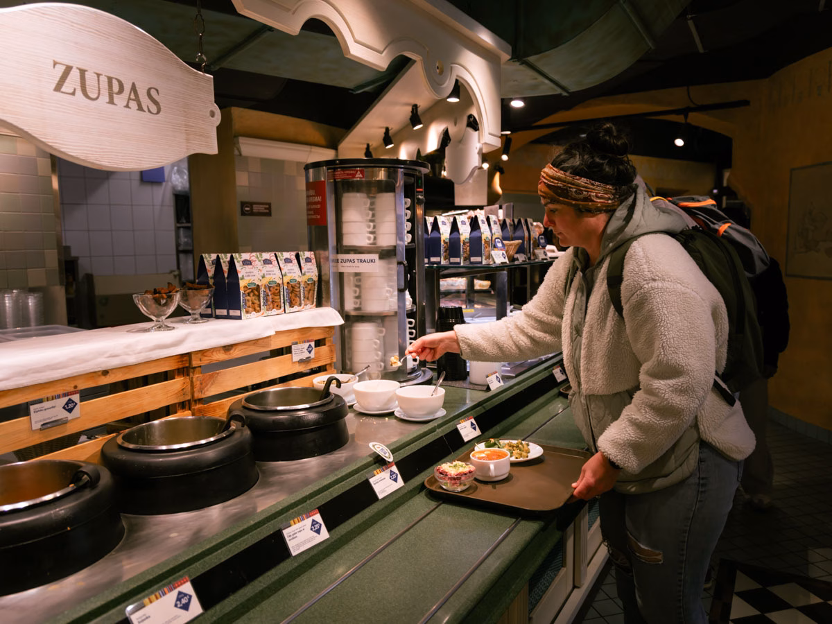 Heather from ArboursAbroad grabbing food at Lido, a buffet style restaurant serving local delicacies, a great way to try all the food if you only have one day in Riga.
